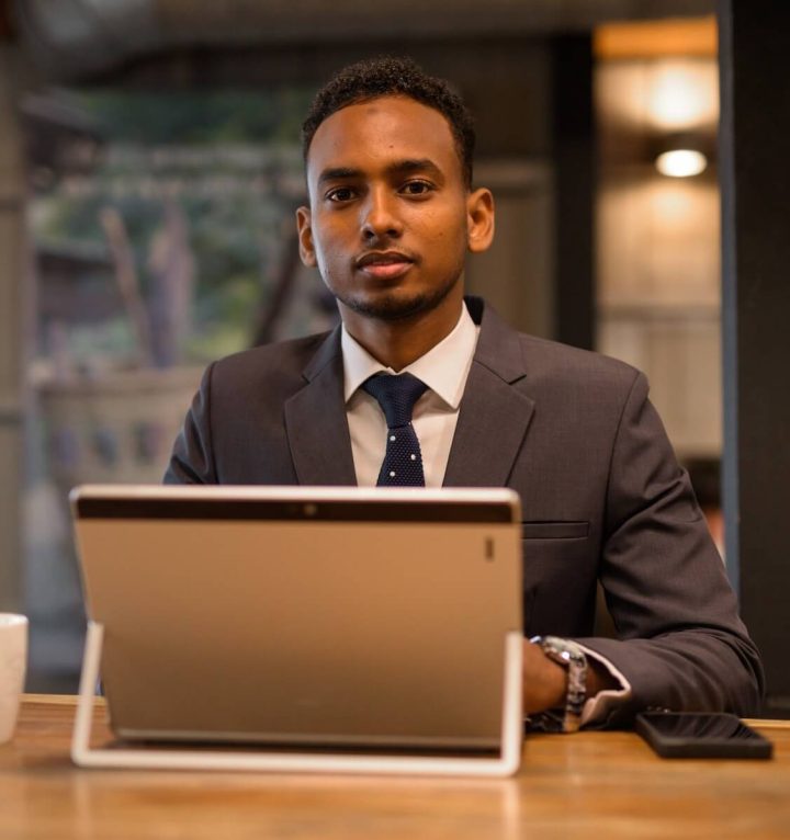young-african-businessman-using-laptop-computer-at-2021-08-29-17-47-17-utc.jpeg